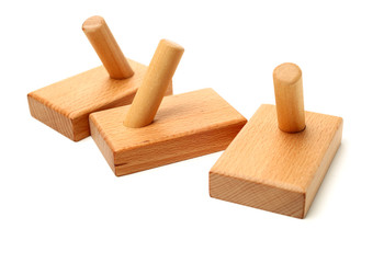 Wooden abstract wall hook isolated on white background