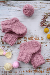 Obraz na płótnie Canvas Soft and warm purple handmade socks for baby girl twins