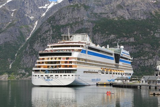 EIDFJORD, NORWAY - JULY 17, 2015: AIDAsol cruise ship in Norway. AIDA sol was built by Meier Werft in 2011. It can carry 2,174 passengers and is operated by Aida Cruises.