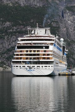 EIDFJORD, NORWAY - JULY 17, 2015: AIDAsol cruise ship in Norway. AIDA sol was built by Meier Werft in 2011. It can carry 2,174 passengers and is operated by Aida Cruises.