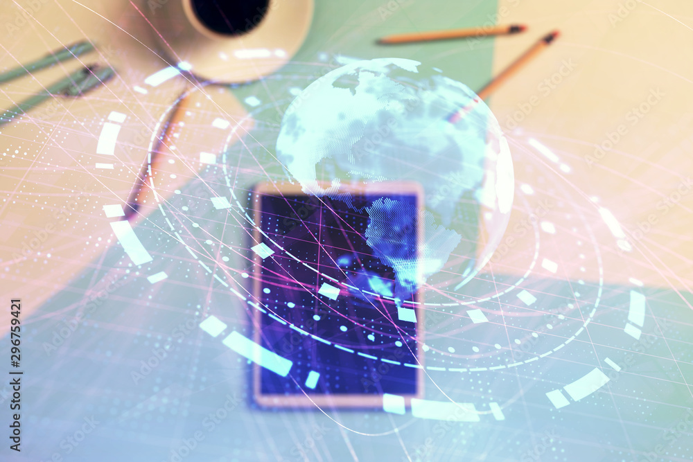 Poster double exposure of world map drawing on digital tablet laying on table background. concept of intern