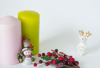 The candles are different, the snowman doll and a set of Christmas wooden toys