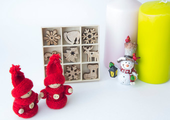 The candles are different, the snowman doll and a set of Christmas wooden toys