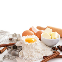 Baking ingredients for christmas cookies on white background