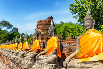Fototapeta na wymiar Aligned Buddha statues at Ayutthaya.