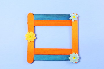 wooden popsicle stick frame isolate with copy space as background
