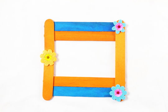 wooden popsicle stick frame isolate with copy space as background
