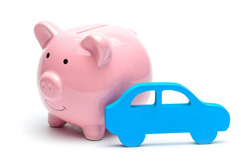 Pink piggy bank and blue car isolated on white background. Concept of saving money on buying a car or car on credit