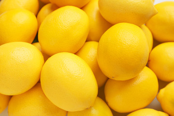 Ripe juicy lemons as background