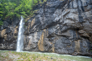 Beautiful scene of small waterfall with rock wall in Aare gorge (Aareschlucht) for background, Meiringen ,Switzerland