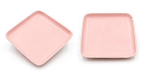 Set of pink square ceramic dishes isolated on white background