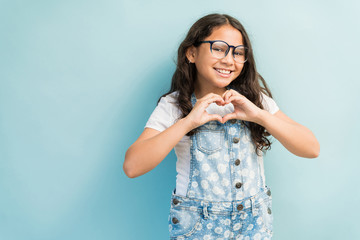 Latin Female Child Gesturing In Studio