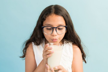 Adorable Girl With Healthy Drink In Studio
