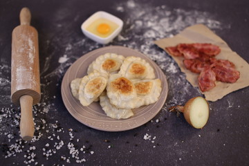 Stuffed dumplings fried in golden brown served with bacon chips