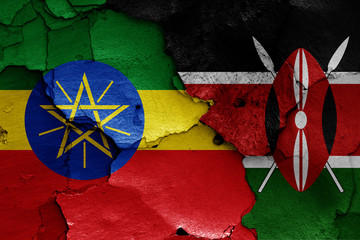 flags of Ethiopia and Kenya painted on cracked wall