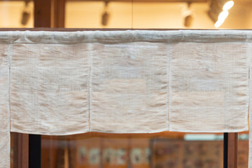 The curtain-like fabric that hangs in front of traditional Japanese restaurants and shops not only serves as a signboard, but holds a larger meaning,