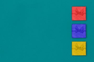 Creative Composition Useful for Christmas and New Year Greeting Card Three Colorful Gift Boxes on The Right Side. Copy Space on The Left Side