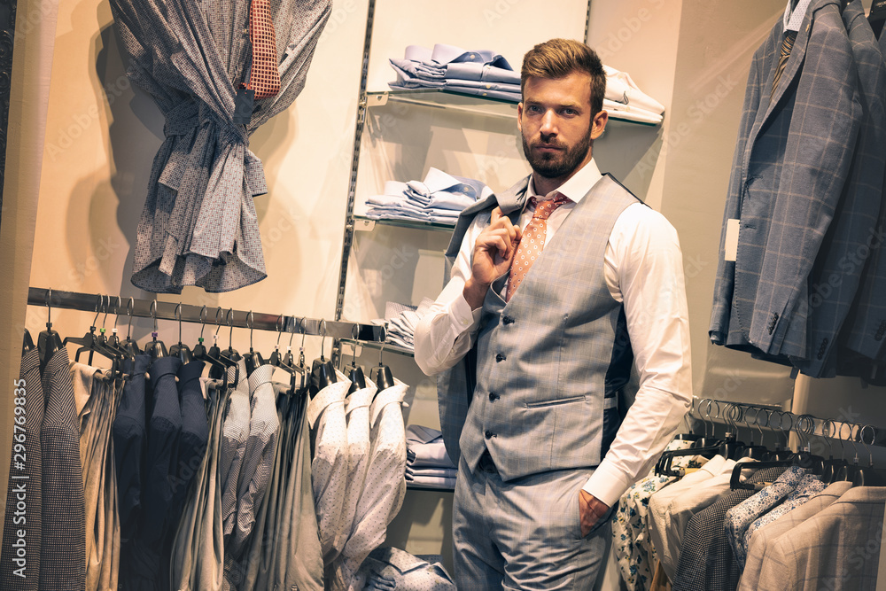 Wall mural Businessman in a shop. Elegant, fashion.