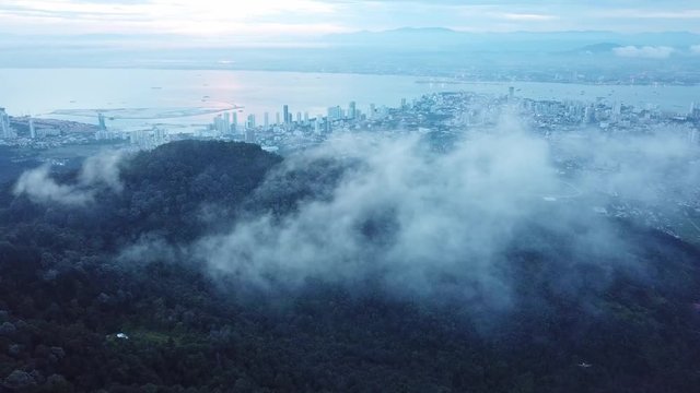 Sunrise over foggy cloud view of George Town City from Penang Hill (Bukit Bendera)