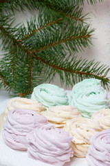Desserts for winter parties. Sweets and spruce branch.