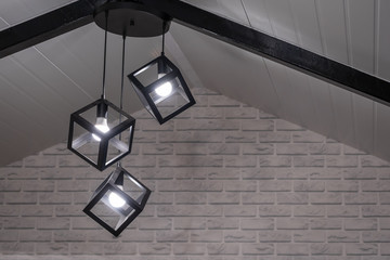Square black metal ceiling lamp cube shape modern interior decoration with brick wall