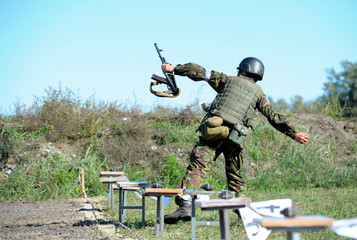 On a military shooting range, training: Ukrainian soldier throwing a grenade