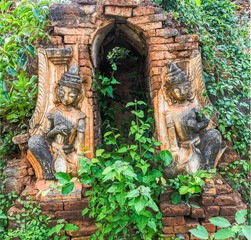 Vegetation taking back the land from the broken Pagoda ruins of a Shwe Inn Dein Pagoda