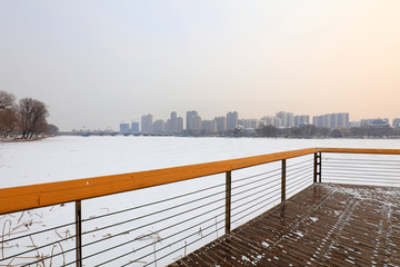 wood trestle bridge in the snow, China