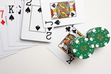 Black Jack cards with pile of casino chips as winning bet