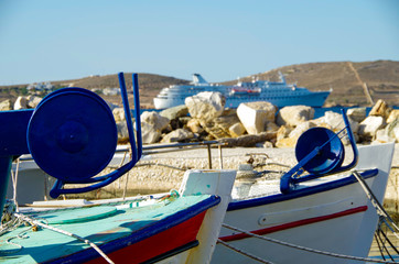 Typical Greek fisher boats on the Cyclade Island of Paros in Marina and panoramic scenic view of...