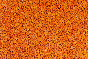 Artificial rubber coating for sports and playgrounds.