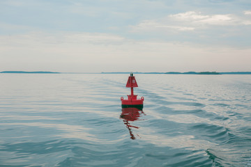 Red buoy on ocean waters