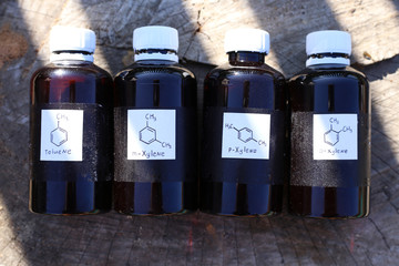 Dark plastic bottles with aromatic hydrocarbons: toluene, m-xylene, p-xylene, o-xylene. Substances...