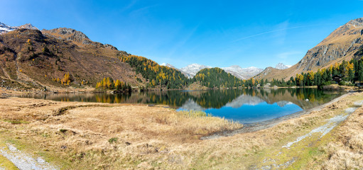 Lake Cavloc at the Maloggia pass during the autumn in the Upper Engadine Switzerland