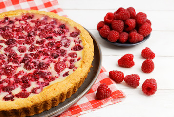 Closeup homemade raspberry pie with yogurt filling. Shallow focus.