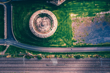 Top-down view Irish small tower and train rails on the coast of Dublin county in Blackrock