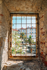 Fototapeta na wymiar Riva street view through fortress window in Split, Croatia