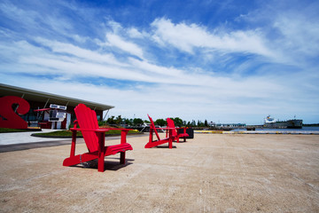 red chairs and blue sky