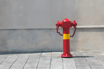 Red fire hydrant for emergency fire access with lighting outdoor.