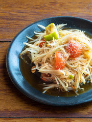 Spicy and pungent papaya salad. A traditional appetizer from Thailand.