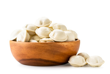 Dumplings in a wooden plate close-up on a white. Isolated.