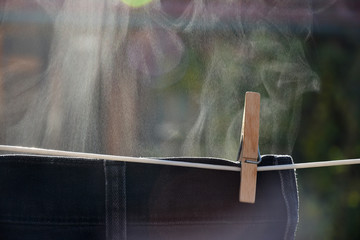 Humidity rising from damp cloth, hanging on clothes line