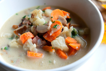 Overhead view of mushrooms soup on table 
