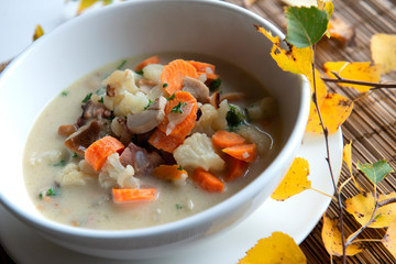 Overhead view of mushrooms soup on table 