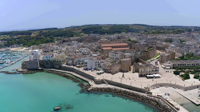 Flight over the Old town and Harbour of Otranto, Lecce province, Salento peninsula, Apulia, Italy, June 2019