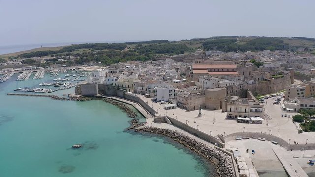 Flight over the Old town and Harbour of Otranto, Lecce province, Salento peninsula, Apulia, Italy, June 2019