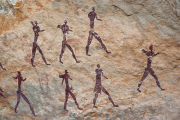 San bushman rock painting of a group of hunters