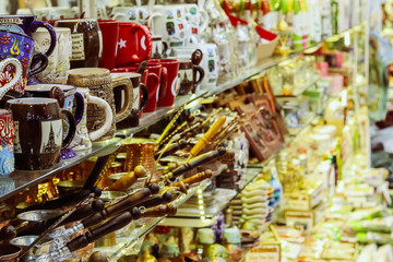 Souvenirs stand in a row on a shelf. Close-up. City souvenir bazaar. Kemer, Turkey.