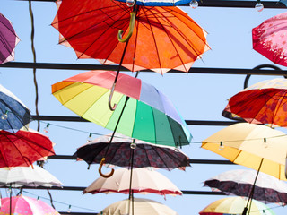 Fototapeta na wymiar Close up, colored umbrellas decorative on a tourist alley..