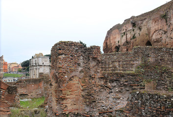 Roman Forum on a cloudy day. Palatino hill in Roma, Italy. Famous historic ruins. Travel photography.